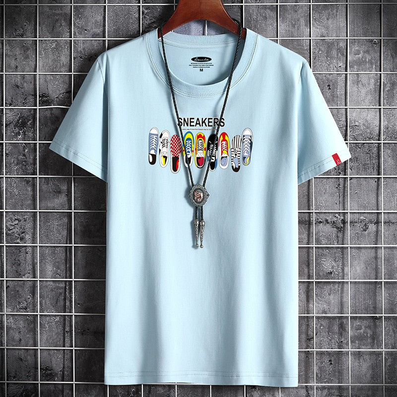 White oversized anime goth graphic tee worn in lifestyle setting, Y2K streetwear style for teen guys | TeenStylo