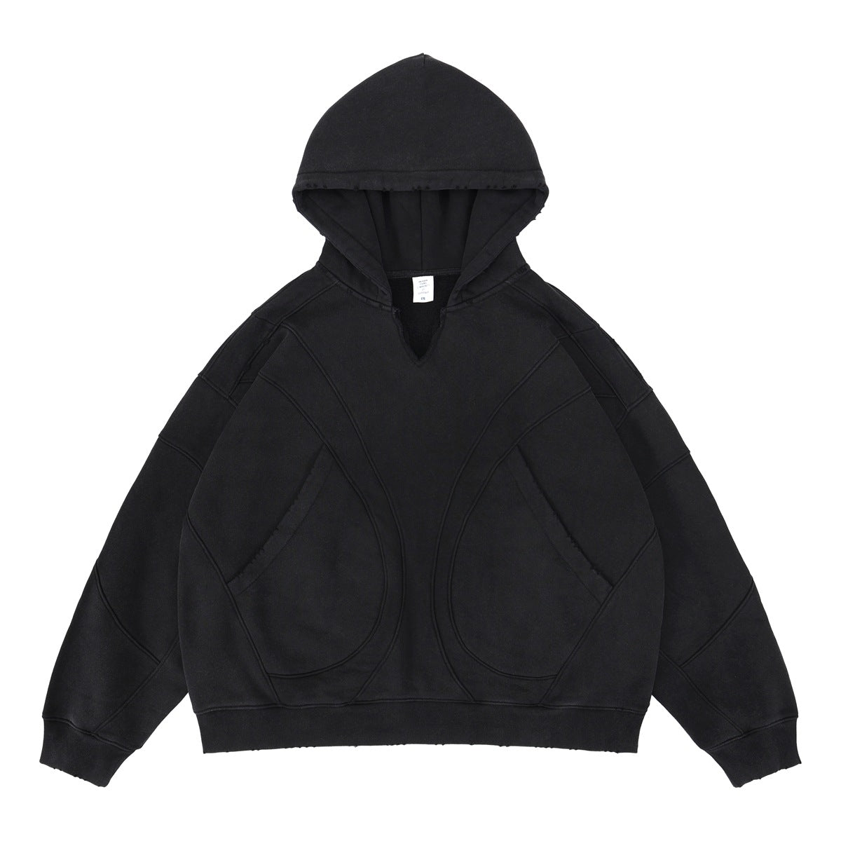 Black oversized patchwork hoodie deconstructed style on male model lifestyle shot – TeenStylo