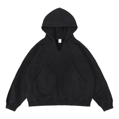Black oversized patchwork hoodie deconstructed style on male model lifestyle shot – TeenStylo