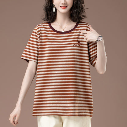 Women wearing a striped short sleeve T-shirt styled in casual streetwear fashion | TeenStylo