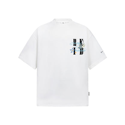 White unisex Y2K streetwear t-shirt with gold line shiny powder embroidery detail lifestyle shot TeenStylo
