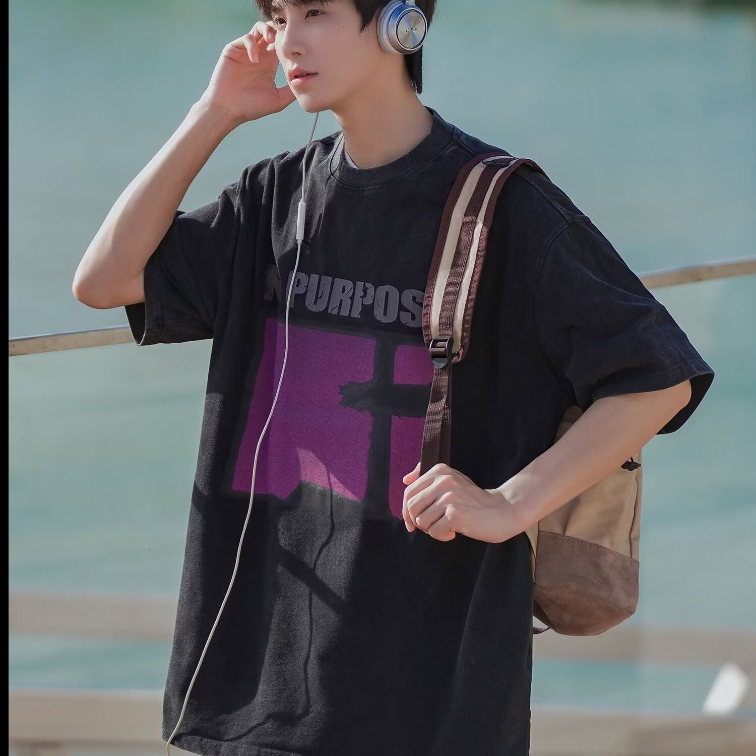 Black streetwear mens short sleeve t-shirt styled in urban lifestyle look | TeenStylo