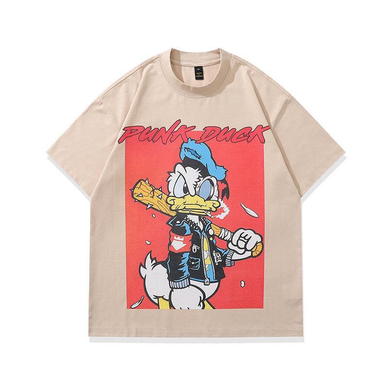 Man wearing sand color cartoon print loose short sleeve couple tee in streetwear lifestyle setting | TeenStylo