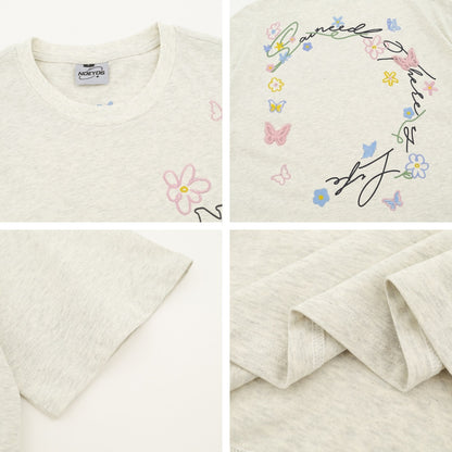 Gray butterfly floral letter embroidery t-shirt styled as lifestyle look, unisex streetwear fashion | TeenStylo
