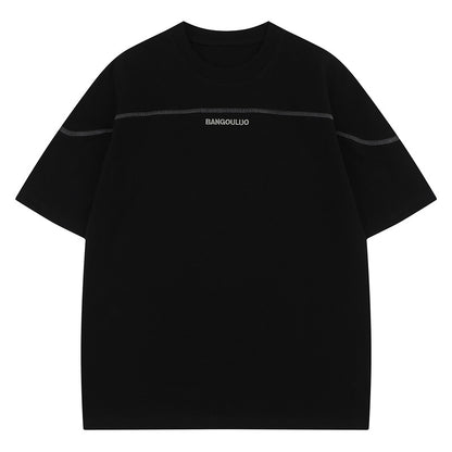 Black unisex loose heavyweight short sleeve tee lifestyle shot, Y2K streetwear style | TeenStylo