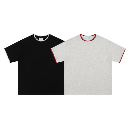 Black unisex loose couple t-shirt close-up detail showing fabric texture and fit | TeenStylo