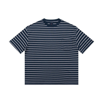 Man wearing blue striped loose fit college style short sleeve t-shirt casual lifestyle shot | TeenStylo
