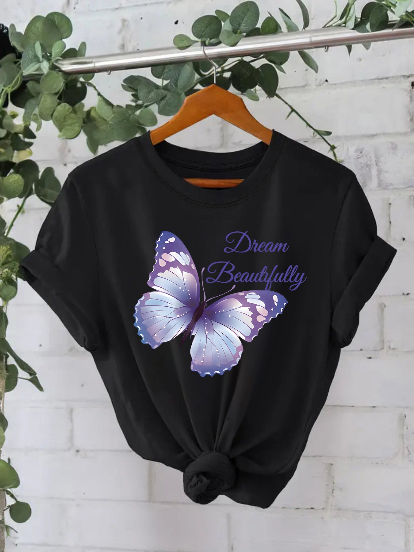 Black women's butterfly short sleeve T-shirt lifestyle look – Y2K streetwear style at TeenStylo