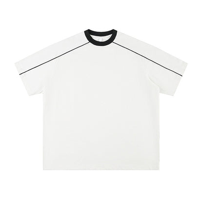 Black unisex loose summer t-shirt close-up detail, short sleeve relaxed fit streetwear style | TeenStylo