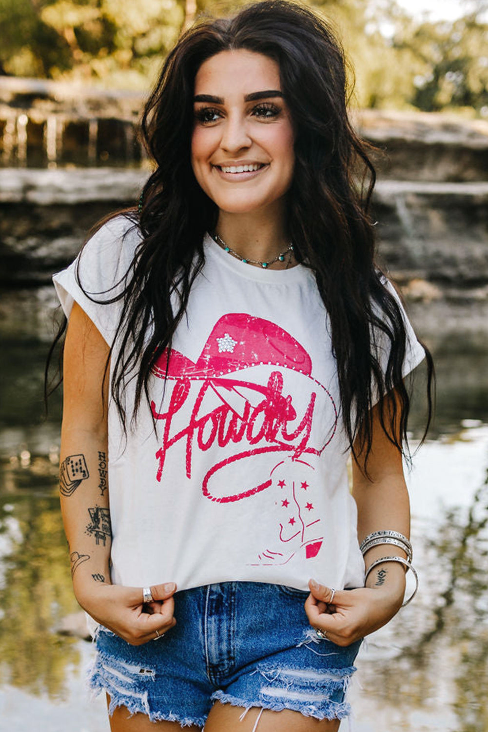 White rhinestone Howdy graphic tee styled in a Y2K streetwear look, unisex fashion at TeenStylo